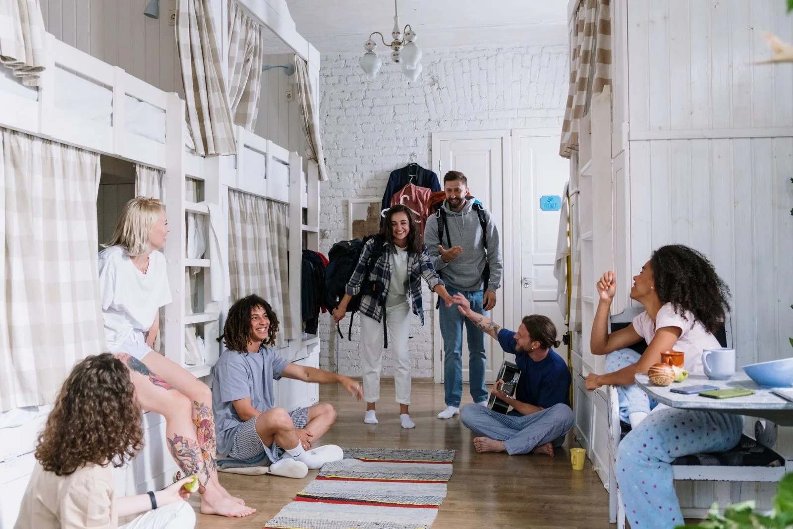 Students hanging out together in a college dorm room on move-in day
